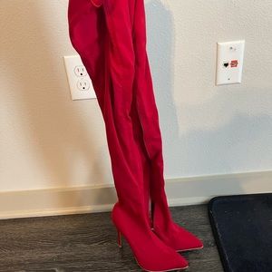 Red thigh high boot